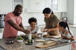 A family preparing breakfast at breakfast time in a clean kitchen